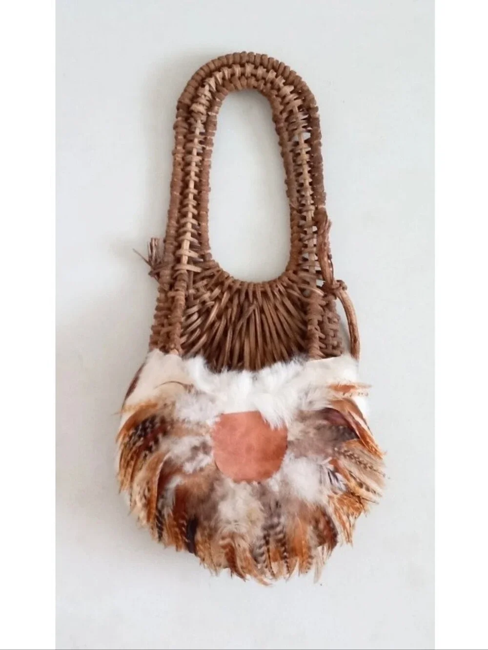 Indigenous Native American vintage natural wicker and feather wall basket